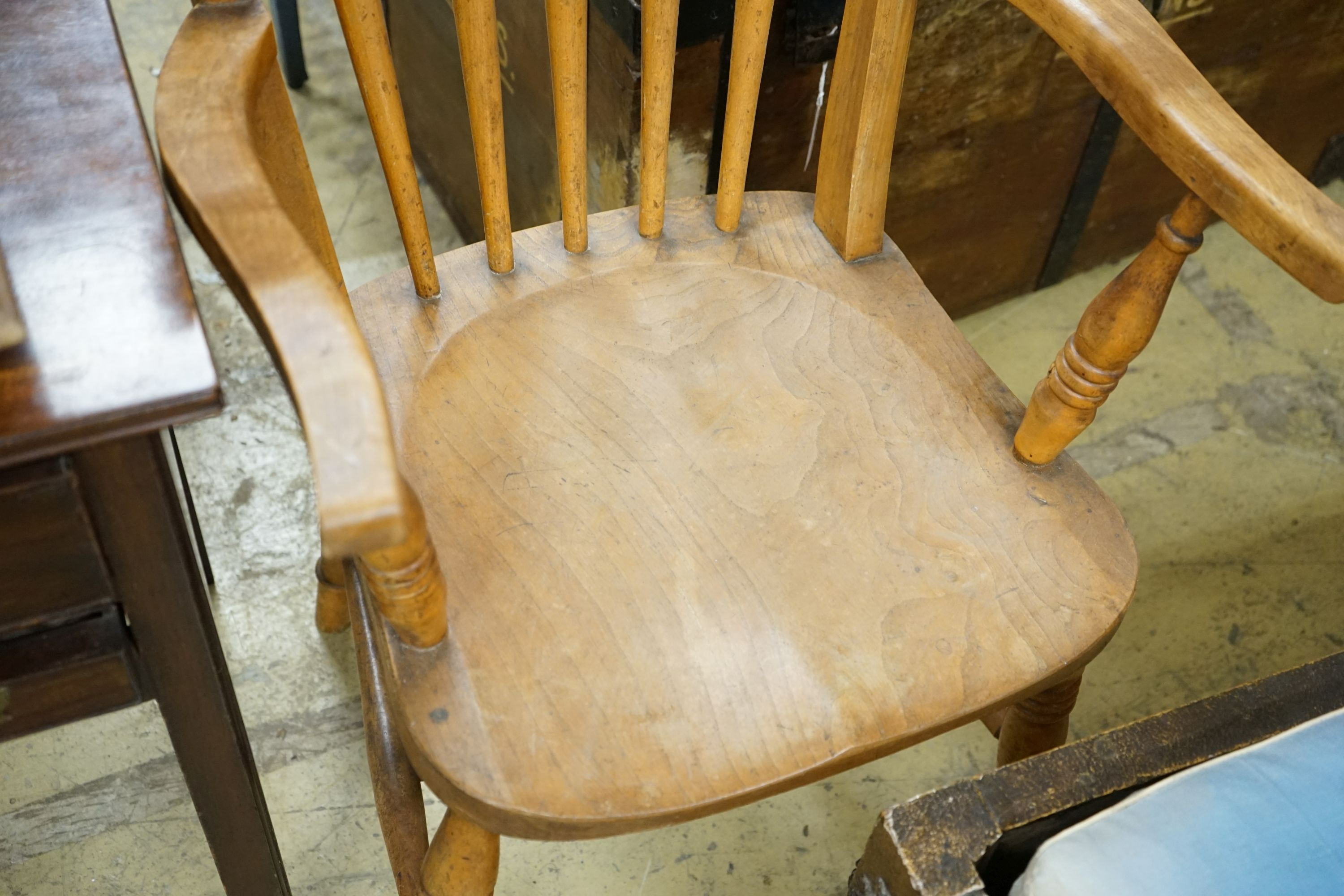 A pair of late Victorian elm and beech Windsor comb back armchairs, width 56cm, depth 47cm, height 112cm